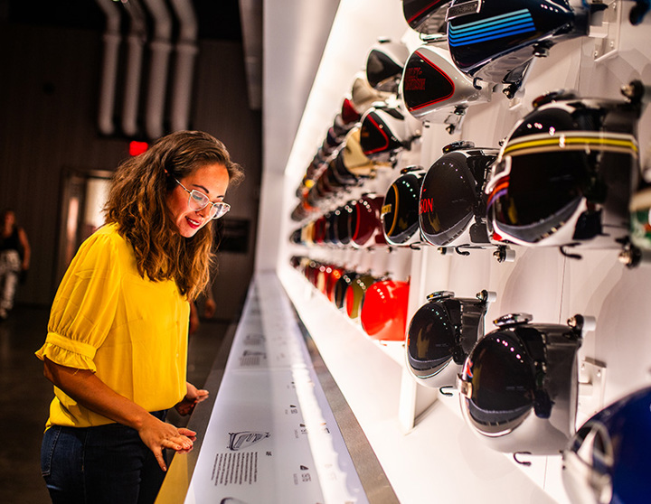 woman looking at display on sporting goods