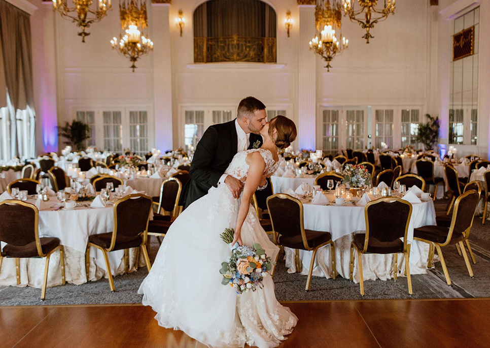 Bride and groom kiss at wedding