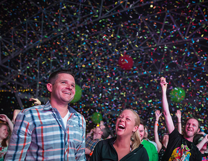 Couple laughing at summerfest confetti everywhere