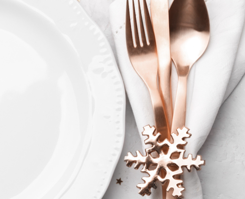 white dinner plate with silverware
