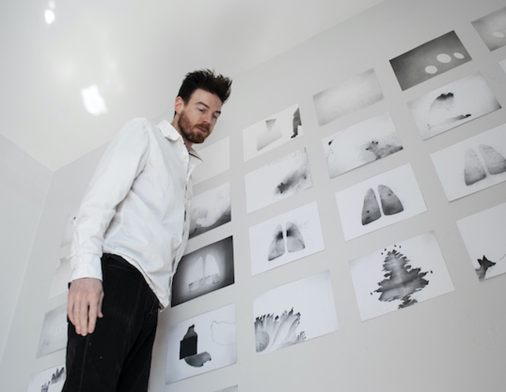 image of previous artist CHRISTOPHER T WOOD next to artwork
