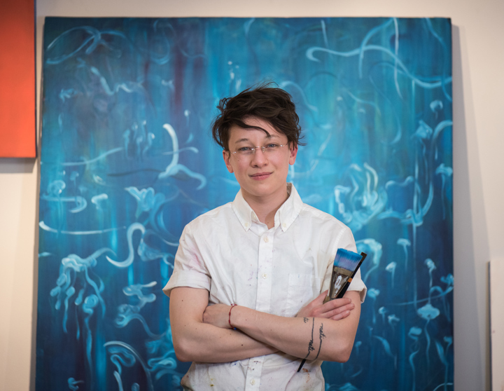Nykoli Koslow with artwork in background