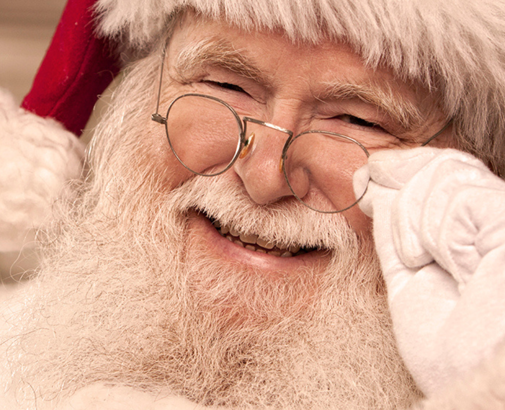 Santa smiling at his list