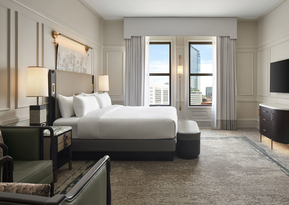 large hotel bedroom with window view